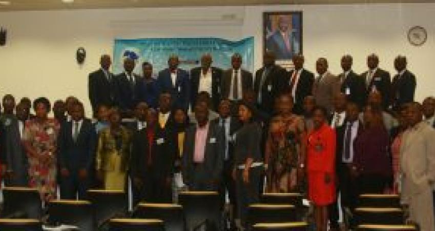 Exe. Gov Patray (5th from left) flanked by DG Siaplay (L) and Officer-In-Charge for Operations, Allison, WAIFEM officials and workshop participants