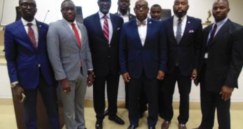 Dr. Siaplay (center), with insurance executives Dr. Siaplay (center), with insurance executives